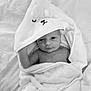 baby, infant, towel, blanket, hooded_towel, cute, wrapped, sleepy, soft, newborn, skin, face, expression, indoors, resting, comfort, portrait, child, cozy, monochrome