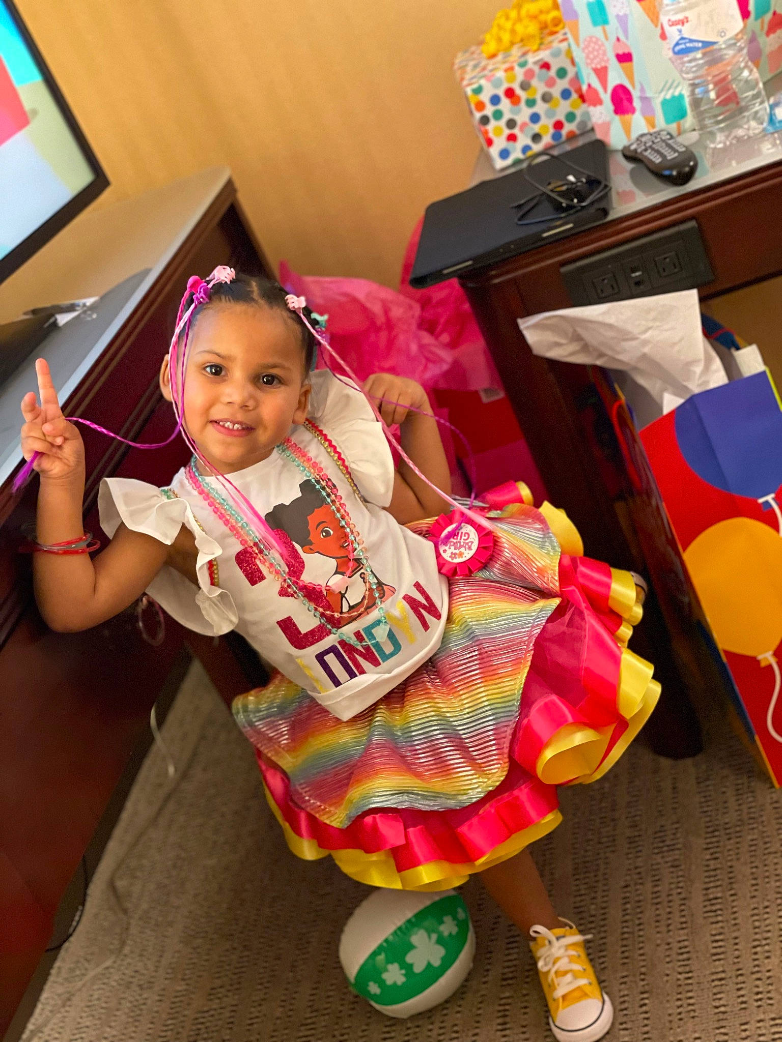 Londyn is registered to the contest to win money with this photo: baby_toddler_clothing, child, costume, event, flooring, fun, happy, joy, magenta, party, party_supply, pattern, person, pink, play, room, sandal, smile, t_shirt, textile