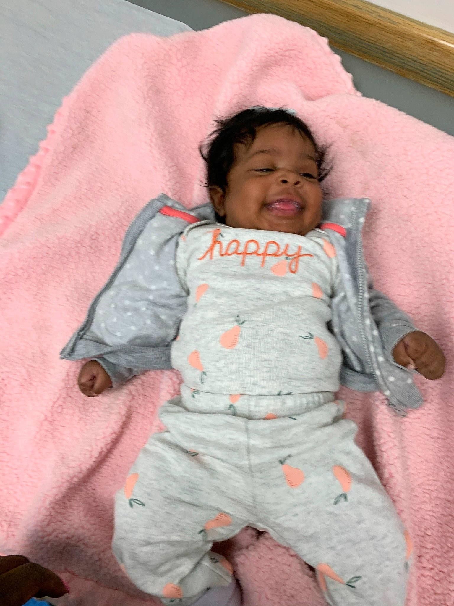 Farah is registered to the contest to win money with this photo: baby, baby_products, baby_sleeping, baby_toddler_clothing, cheek, child, comfort, face, happy, head, linens, outerwear, pattern, person, pink, room, skin, sleeve, smile, textile