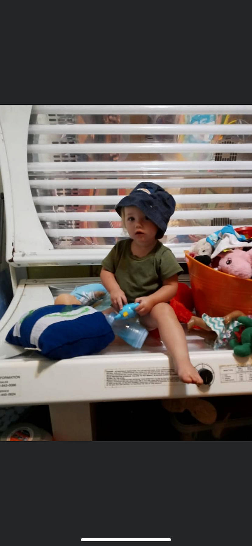 Emily Neveah is registered to the contest to win money with this photo: baby, baseball_cap, cap, child, comfort, electric_blue, fedora, fun, hat, headwear, helmet, knee, leisure, person, play, recreation, shorts, sitting, sun_hat, t_shirt