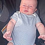 baby, infant, onesie, striped_clothing, stroller, child, rosy_cheeks, face, arm, hand, legs, seatbelt, child_safety, casual, indoor, portrait, cute, soft_light, chubby, relaxed