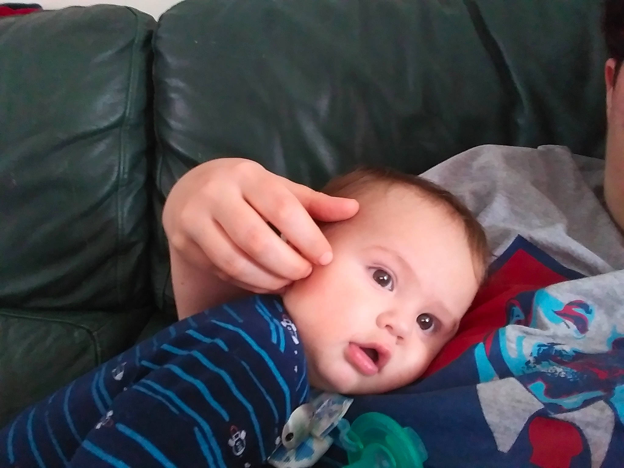 Evander is registered to the contest to win money with this photo: arm, baby, cheek, child, chin, eye, eyebrow, face, finger, forehead, hand, head, iris, leg, lip, mouth, nose, person, skin, thumb