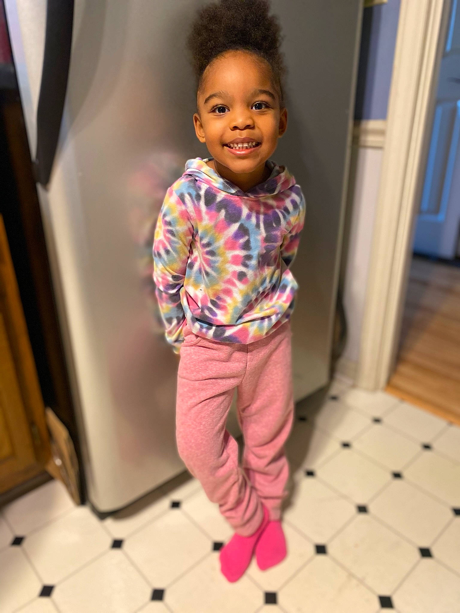 Joleigh is registered to the contest to win money with this photo: baby, baby_toddler_clothing, child, door, fashion_design, flooring, fun, happy, hardwood, joy, magenta, pajamas, pattern, person, purple, room, sleeve, smile, sweatpant, toddler