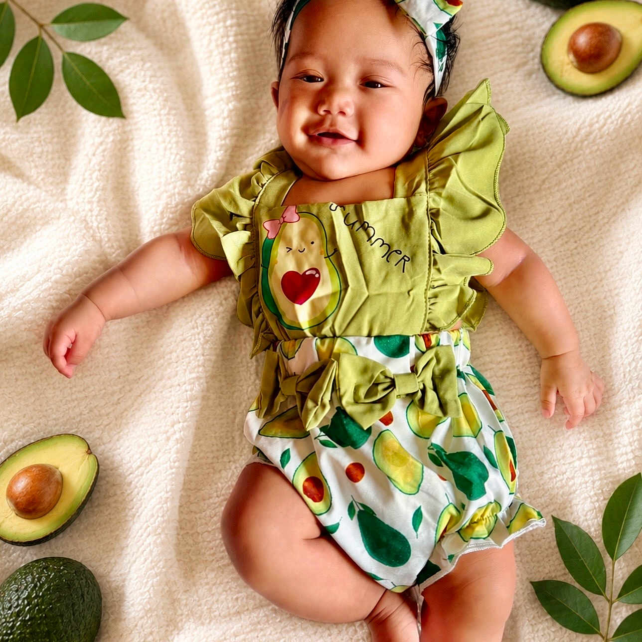 Cleiah Bright is registered to the contest to win money with this photo: baby, infant, child, smiling, avocado, fruit, green_leaves, blanket, clothing, headband, cute, lying_down, happy, portrait, toddler, nature, fresh, soft_texture, playful, outdoor_style
