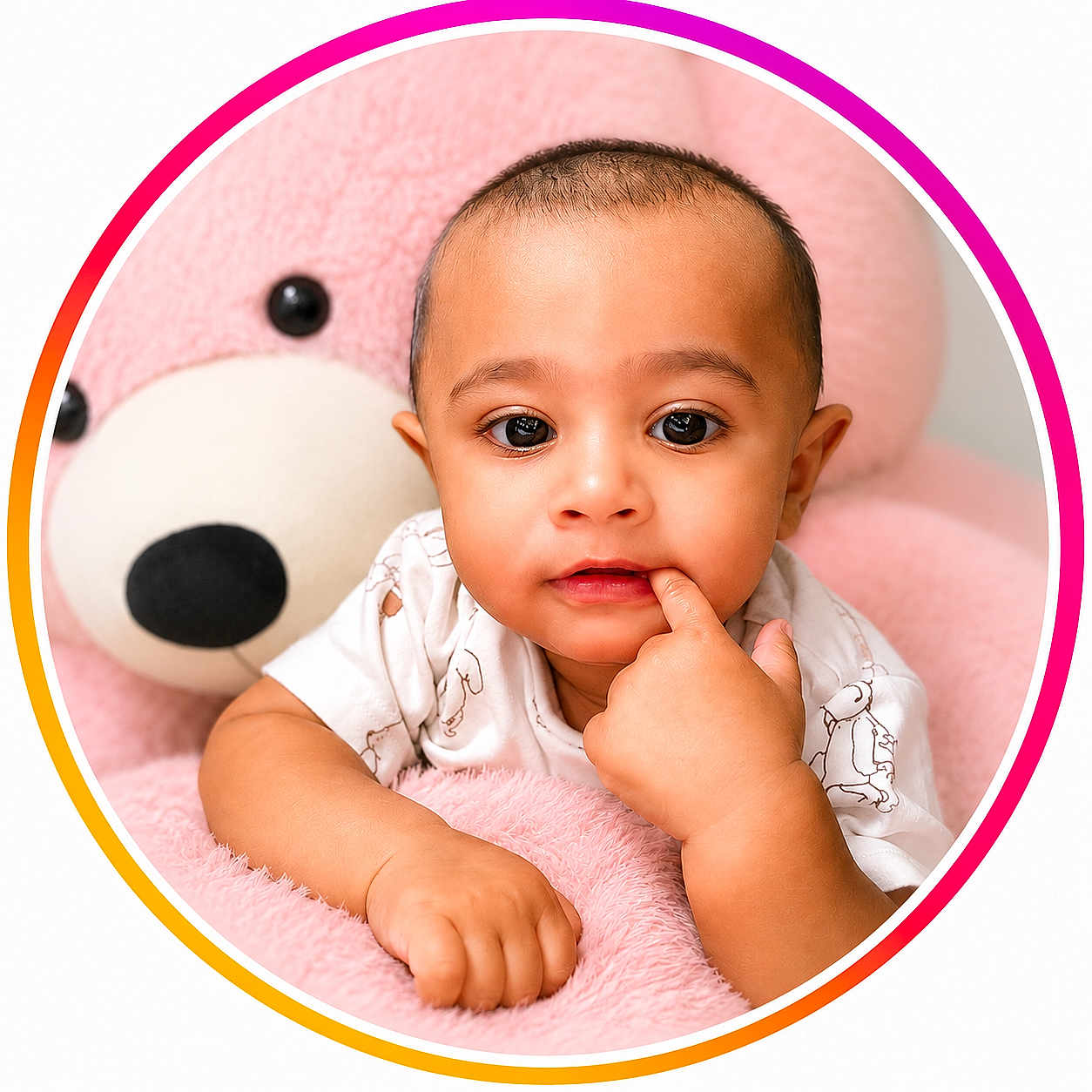 Yusuf joined the competition — help win amazing prizes! baby, child, teddy_bear, pink, cute, portrait, indoor, soft_toy, hand, face, young, childhood, smiling, looking_at_camera, clothing, infant, circular_frame, furniture, plush, expression