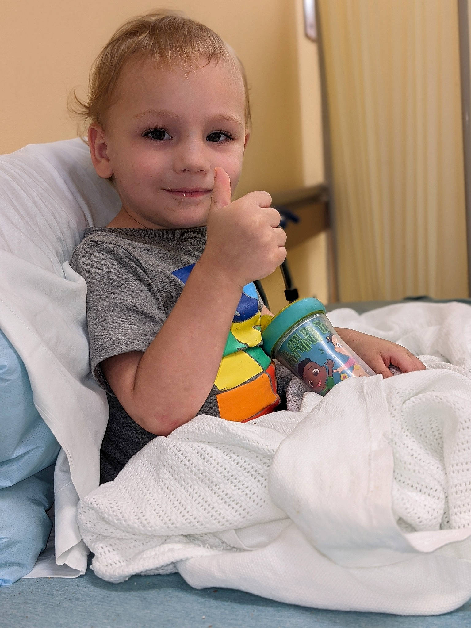 Sebastian is registered to the contest to win money with this photo: arm, baby, baby_toddler_clothing, cheek, child, comfort, curtain, finger, gesture, happy, head, joint, joy, knee, linens, person, shoulder, skin, sleeve, smile