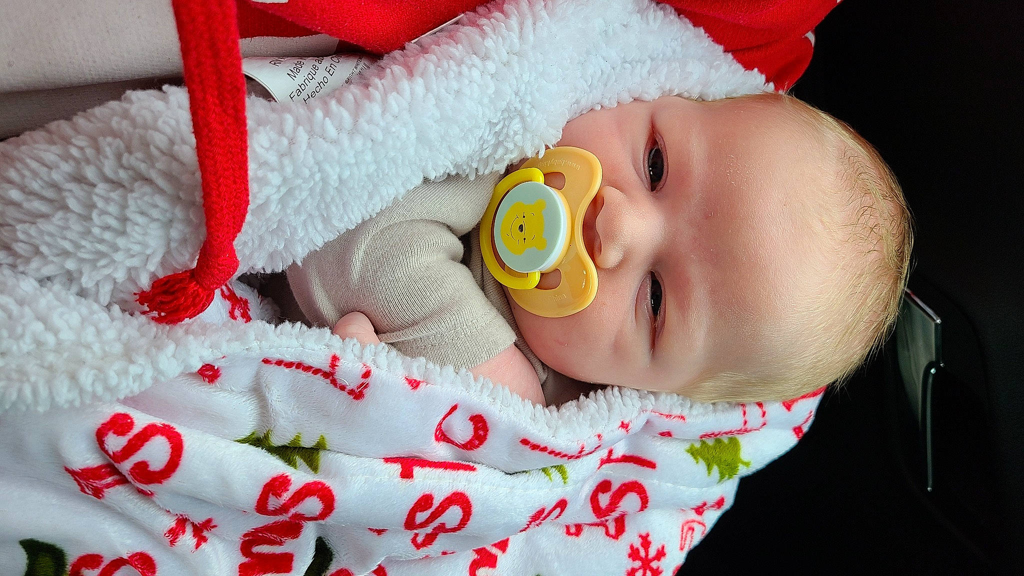 Brylon is registered to the contest to win money with this photo: baby, baby_products, baby_safety, baby_sleeping, baby_toddler_clothing, cheek, child, close_up, comfort, finger, happy, headgear, linens, nose, person, product, red, skin, smile, toddler