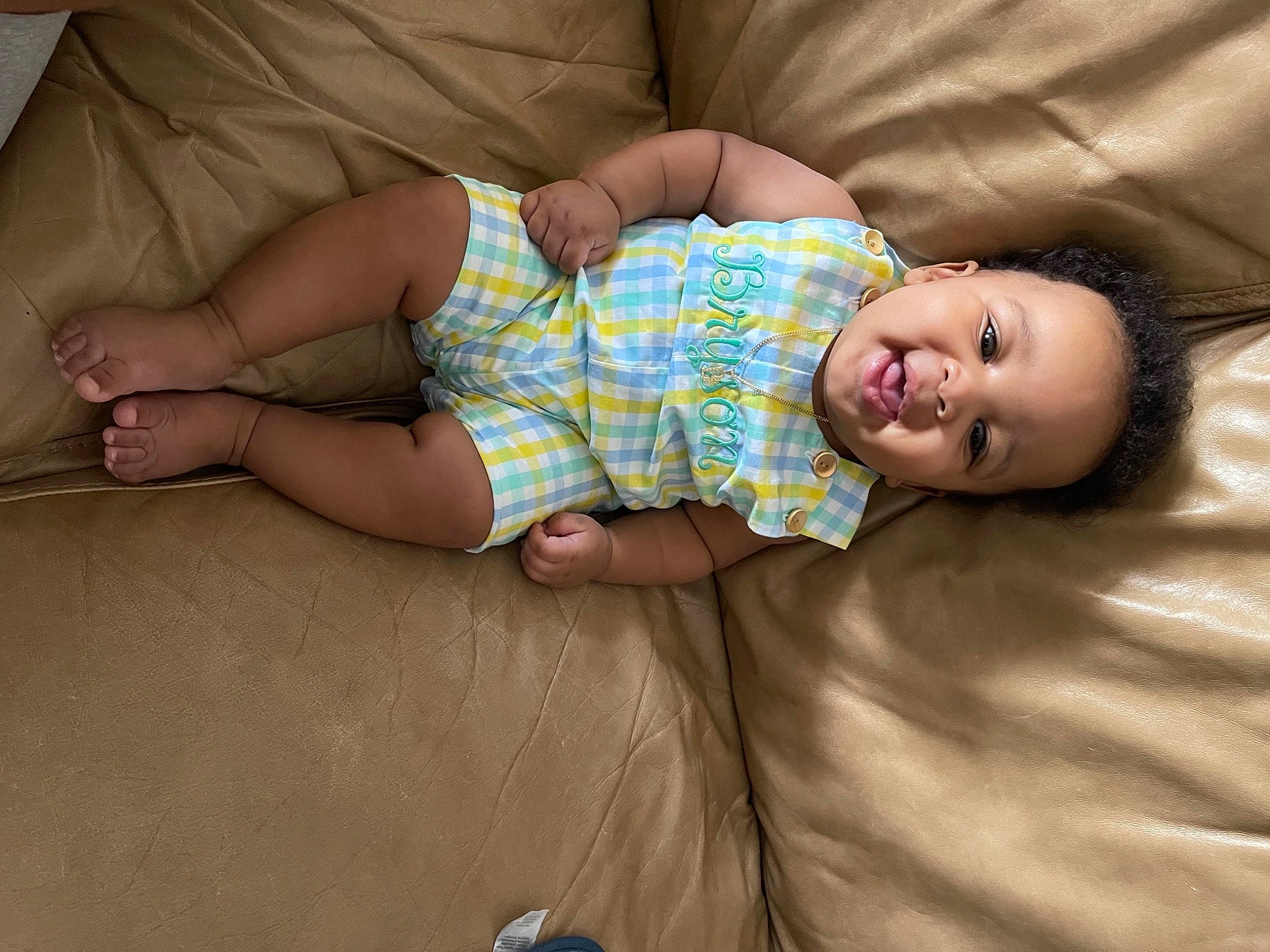 Bryson joined the competition — help win amazing prizes! baby, baby_toddler_clothing, child, comfort, couch, eye, flash_photography, flooring, fun, hair, happy, head, human_leg, iris, linens, person, sitting, skin, smile, toddler