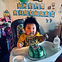Elwood Liam Brown is registered to the contest to win money with this photo: toddler, child, cake, birthday, high_chair, messy, balloon, toy, milk_bottle, celebration, party, indoor, wall_decorations, face_paint, food, smiling, hair, clothing, furniture, happy