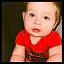 baby, child, face, blue_eyes, red_shirt, cute, portrait, infant, chubby_cheeks, skin, person, young, sitting, indoors, expression, looking_at_camera, closeup, adorable, human, toddler