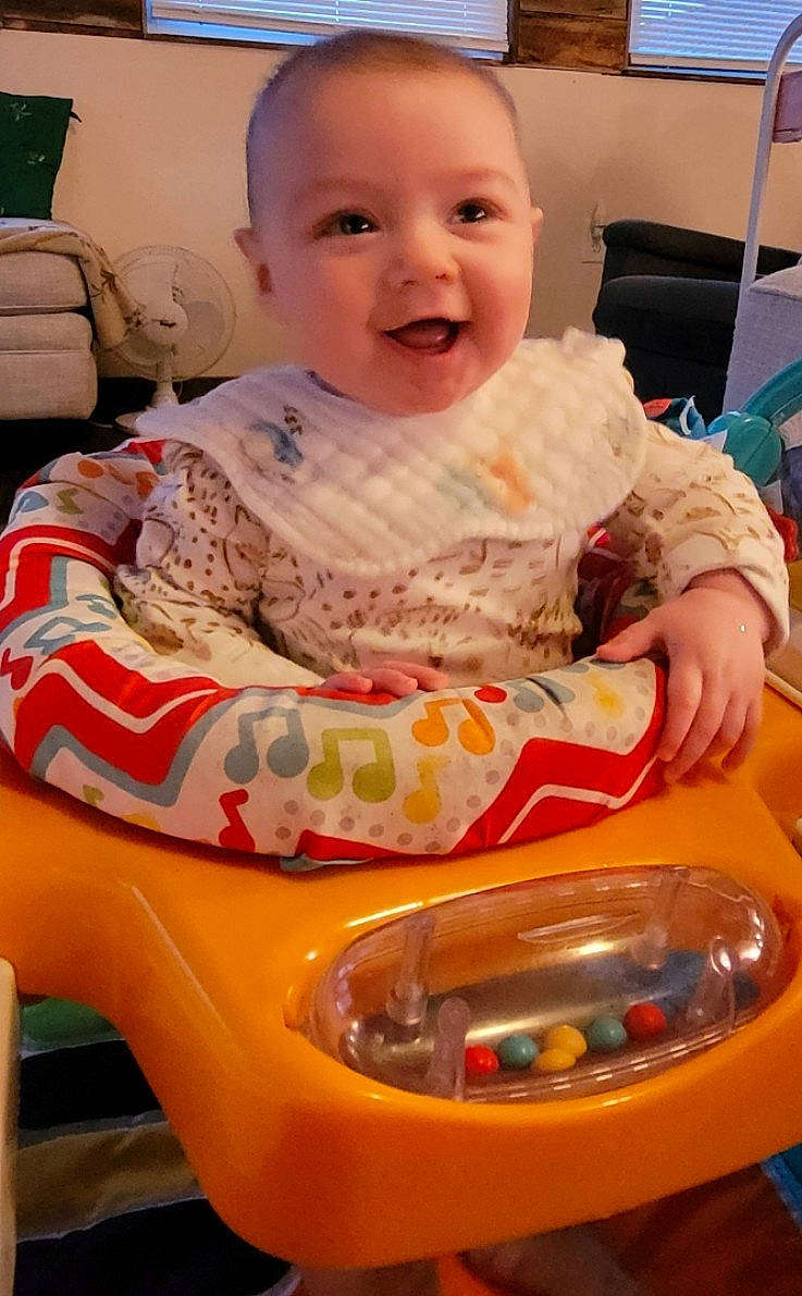 Sadie joined the competition — help win amazing prizes! baby, baby_toddler_clothing, chair, cheek, child, chin, eye, face, fun, hairstyle, happy, head, iris, luggage_and_bags, mouth, person, room, sitting, skin, smile