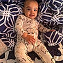 Ashure Matthews is registered to the contest to win money with this photo: baby, infant, onesie, elephant_pattern, blanket, geometric_pattern, smiling, face, hand, comfort, cute, child, portrait, indoor, fabric, texture, cozy, bed, relaxed, young