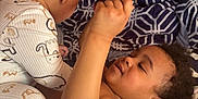 Ashure Matthews is registered to the contest to win money with this photo: toddler, baby, child, bed, blanket, pajamas, curiosity, indoor, playing, interaction, person, holding, object, pattern, sleepwear, cute, family, candid, cozy, closeup