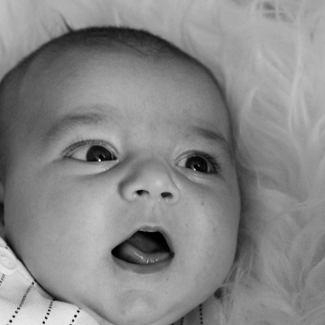 Owen a rejoint le concours — aidez-le/la à gagner de superbes lots ! baby, black_and_white, button, child, close_up, clothing, cute, expression, eyes, face, fluffy, infant, mouth, newborn, portrait, skin, soft, striped, texture, young