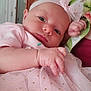 Harmony is registered to the contest to win money with this photo: baby, child, closeup, curious, cute, dress, fabric, face, hand, headband, holding, indoor, infant, newborn, person, pink, portrait, skin, soft, tulle