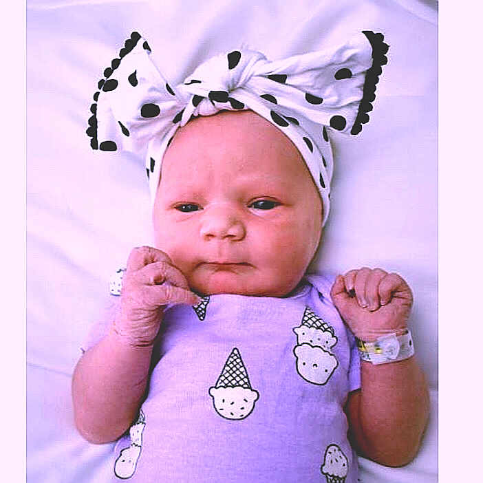Alice Rayne is registered to the contest to win money with this photo: baby, baby_products, baby_toddler_clothing, cheek, child, costume_accessory, costume_hat, ear, fashion_accessory, hair_accessory, head, headband, headgear, headpiece, organ, person, pink, product, purple, toddler