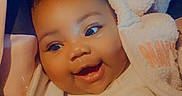 Darria is registered to the contest to win money with this photo: baby, smiling, child, face, happy, cute, jacket, cozy, infant, portrait, young, warm, clothing, expression, head, person, skin, indoors, closeup, eyes