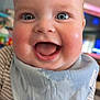 Maisey is registered to the contest to win money with this photo: baby, blue_eyes, bib, cheeks, clothing, cute, face, happy, indoor, infant, joy, mouth_open, person, portrait, smiling, striped_clothing, toddler, wearing, wet_bib, young_child