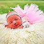 baby, sleeping, newborn, pink_tutu, lace_clothing, headband, fluffy_blanket, white_blanket, outdoor, green_background, closeup, portrait, peaceful, soft_texture, infant, cute, resting, baby_fashion, small_hands, smiling