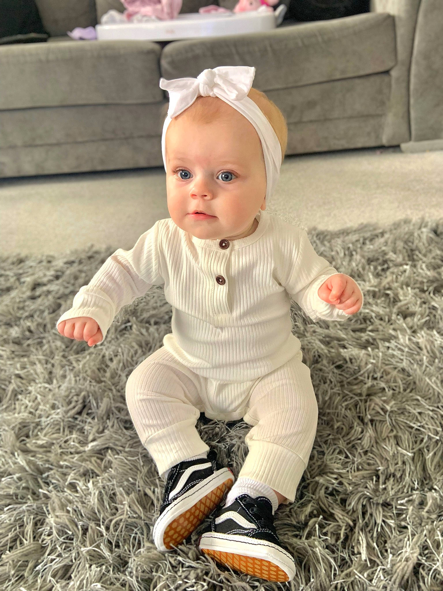 Esmée joined the competition — help win amazing prizes! baby, baby_toddler_clothing, ball, child, eye, flooring, football, fun, grass, happy, hat, head, human_body, people_in_nature, person, sitting, sleeve, soil, studio_couch, toddler