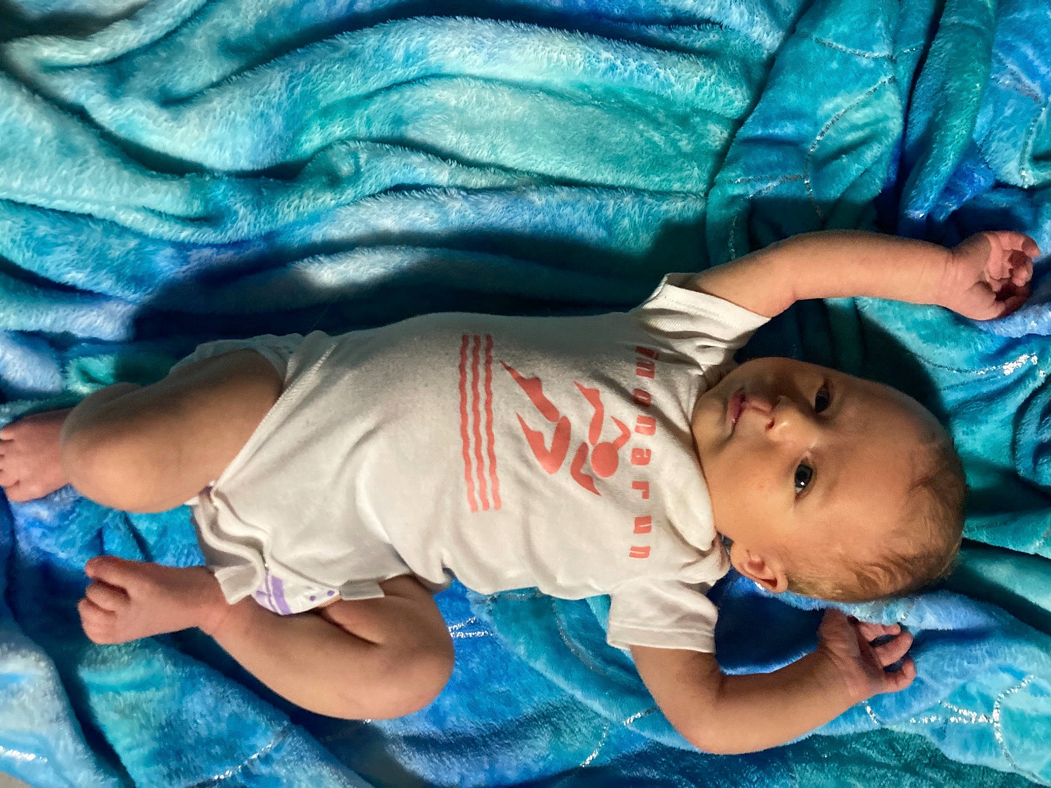 Zarah is registered to the contest to win money with this photo: azure, baby, baby_toddler_clothing, blue, cheek, child, comfort, electric_blue, finger, head, human, human_body, joint, mouth, muscle, organ, person, photograph, skin, textile
