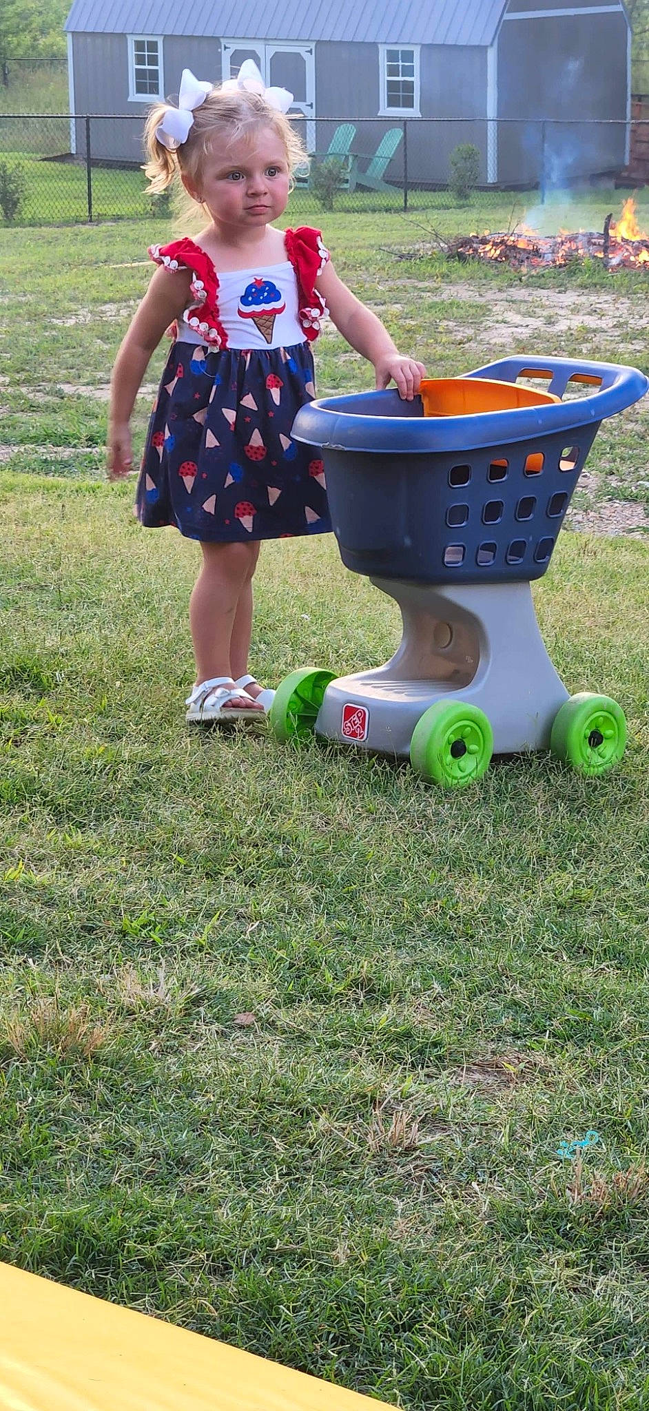 Charleigh is registered to the contest to win money with this photo: art, child, electric_blue, fun, games, garden, gas, grass, grassland, lawn, leisure, pattern, people_in_nature, person, plant, play, recreation, sitting, soil, summer