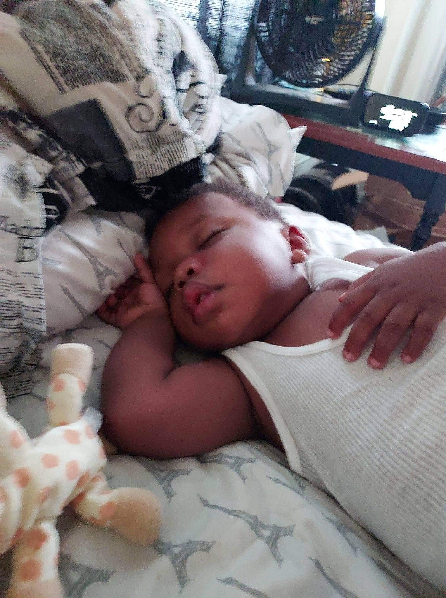 Camren is registered to the contest to win money with this photo: baby, bed, bed_sheet, bedding, bedtime, child, comfort, event, fur, hand, linens, mammal, mechanical_fan, muscle, nap, organ, person, room, skin, toddler