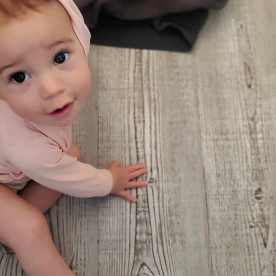 Emery joined the competition — help win amazing prizes! baby, bodypart, cap, clothing, dress, face, finger, hand, hardwood, hat, head, indoors, interiordesign, newborn, pants, person, photography, plywood, portrait, wood