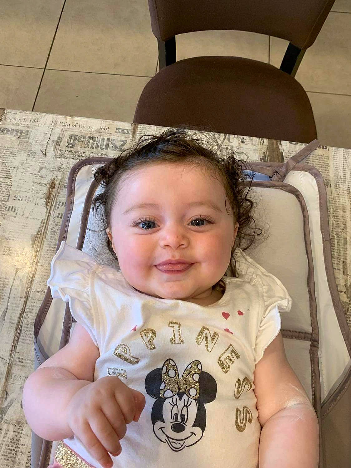 April participe au concours pour gagner de l'argent avec cette photo : baby, baby_toddler_clothing, car_seat, car_seat_cover, cheek, child, chin, eyelash, fun, happy, joy, person, product, sitting, skin, sleeve, smile, steering_wheel, thumb, toddler