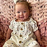 Hadleigh Rose joined the competition — help win amazing prizes! baby, child, closeup, clothing, cute, face, flower_hair_clip, happy, indoors, infant, person, pink_blanket, polka_dot, portrait, sitting, smiling, soft_texture, textured_blanket, white_clothing, wooden_buttons
