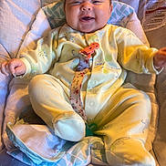 Hadleigh Rose is registered to the contest to win money with this photo: baby, baby_seat, child, comfort, cozy, cute, face, feet, hands, happy, indoor, infant, onesie, pacifier_clip, plush, portrait, sitting, smiling, soft_lighting, yellow_clothing