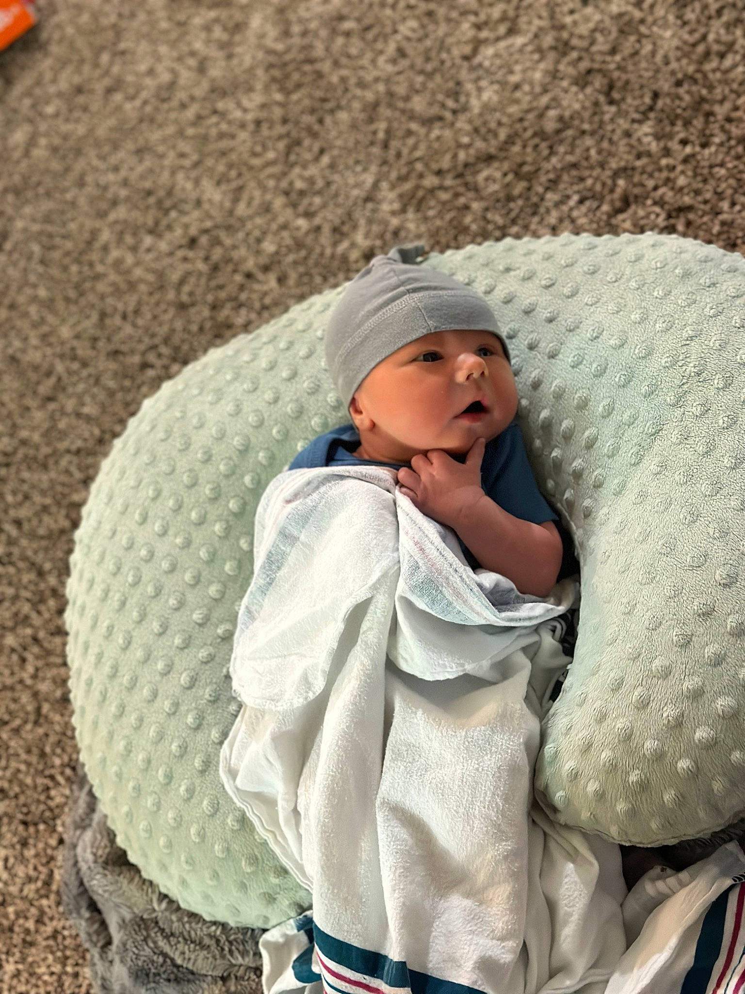 Leighton joined the competition — help win amazing prizes! bag, beanie, cap, child, comfort, craft, fashion_accessory, fur, grass, headgear, headwear, knit_cap, landscape, leisure, linens, pattern, person, recreation, sitting, wool