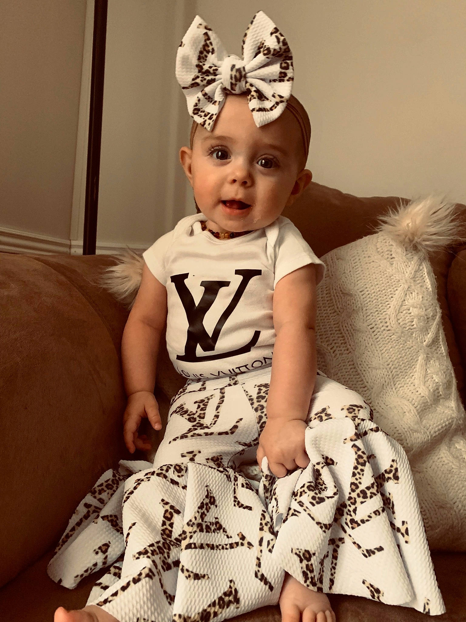 Mylah joined the competition — help win amazing prizes! baby, baby_toddler_clothing, cap, costume_hat, day_dress, fashion_design, flash_photography, fun, hair_accessory, happy, head, headband, headgear, headpiece, jewellery, necklace, one_piece_garment, person, sleeve, toddler