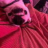 Piggy-Roo joined the competition — help win amazing prizes! dog, smile, teeth, upside_down, blanket, red, texture, indoor, pet, close_up, nose, fur, collar, resting, cozy, pink_light, playful, cute, animal, canine