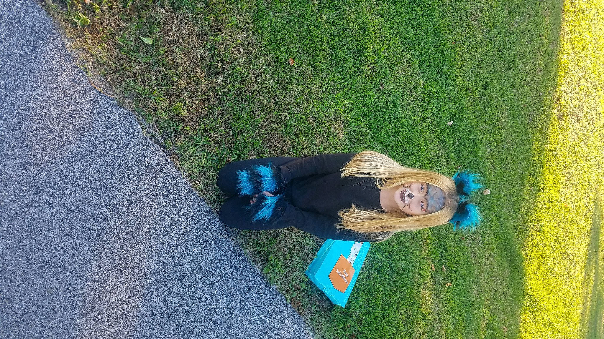 Lacie is registered to the contest to win money with this photo: asphalt, cobalt_blue, electric_blue, grass, green, joy, mammal, people_in_nature, person, road_surface, tar, teal, turquoise