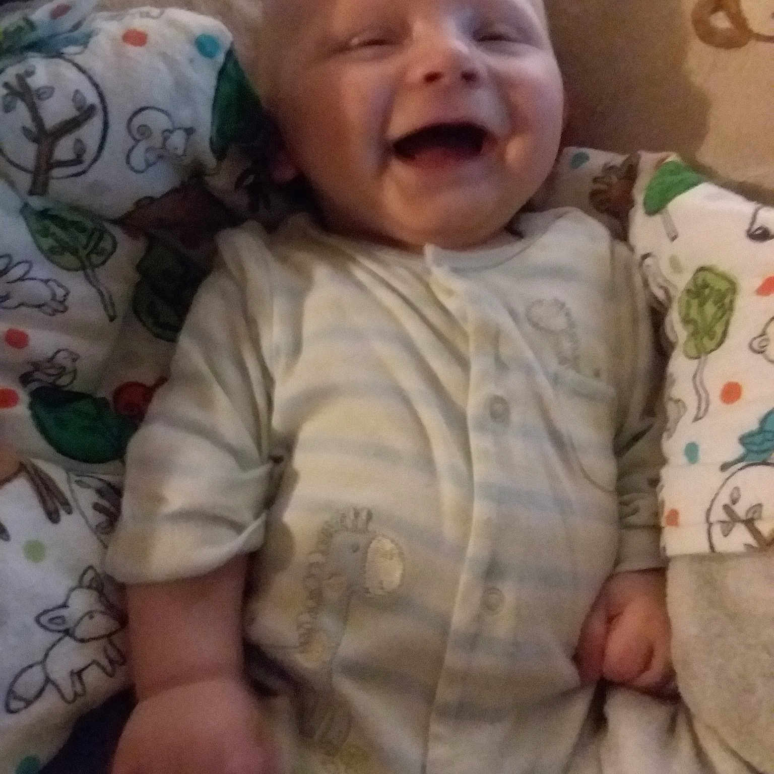 Bradyn is registered to the contest to win money with this photo: arm, bedtime, boy, cheek, child, day, eye, face, facial_expression, finger, head, infant, mouth, nose, person, product, skin, sleep, smile, toddler