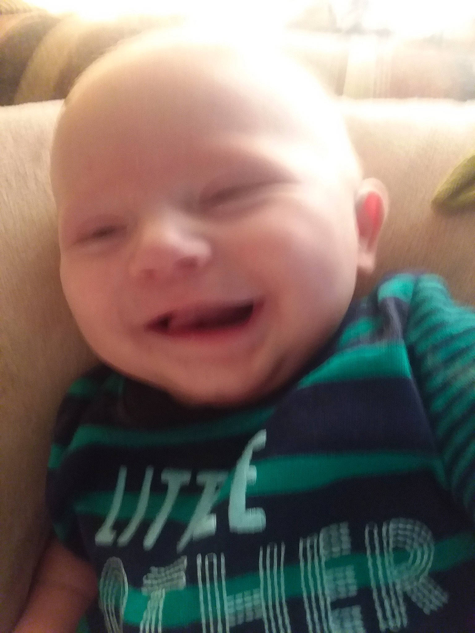 Bradyn is registered to the contest to win money with this photo: arm, cheek, child, chin, day, eye, eyebrow, face, finger, forehead, hand, head, human_hair_color, infant, lip, mouth, nose, person, skin, toddler