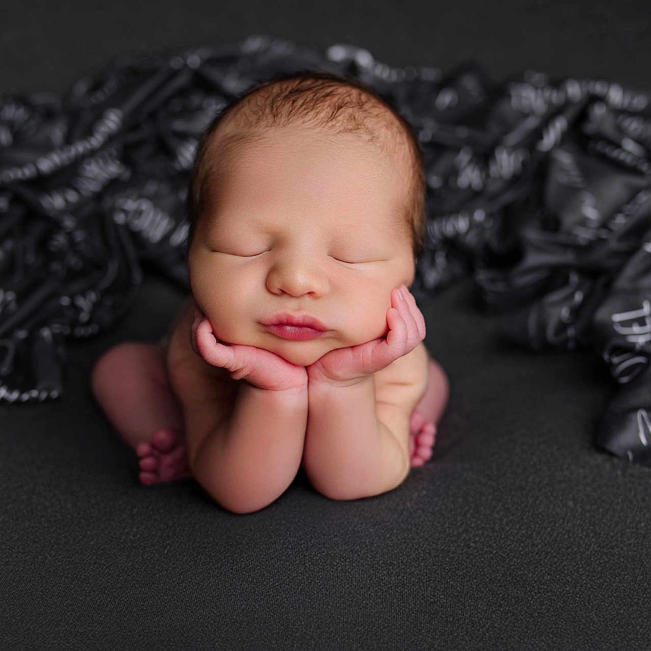 Jordan is registered to the contest to win money with this photo: baby, blanket, bodypart, clothing, face, finger, glove, hand, happy, head, newborn, person, photography, portrait, sleeping, smile