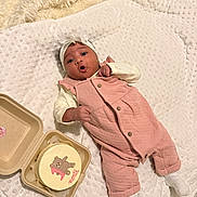 Malya participe au concours pour gagner de l'argent avec cette photo : baby, infant, pink_overalls, white_headband, white_blanket, cake, bear_cake_decoration, cute, indoor, lying_down, expression, celebration, soft_texture, cozy, hands, feet, clothing, food, tableware, person