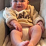 baby, smiling, sweater, knitwear, infant, happy, face, feet, cozy, chair, blanket, soft, cute, child, portrait, indoors, warm, relaxed, furniture, seated
