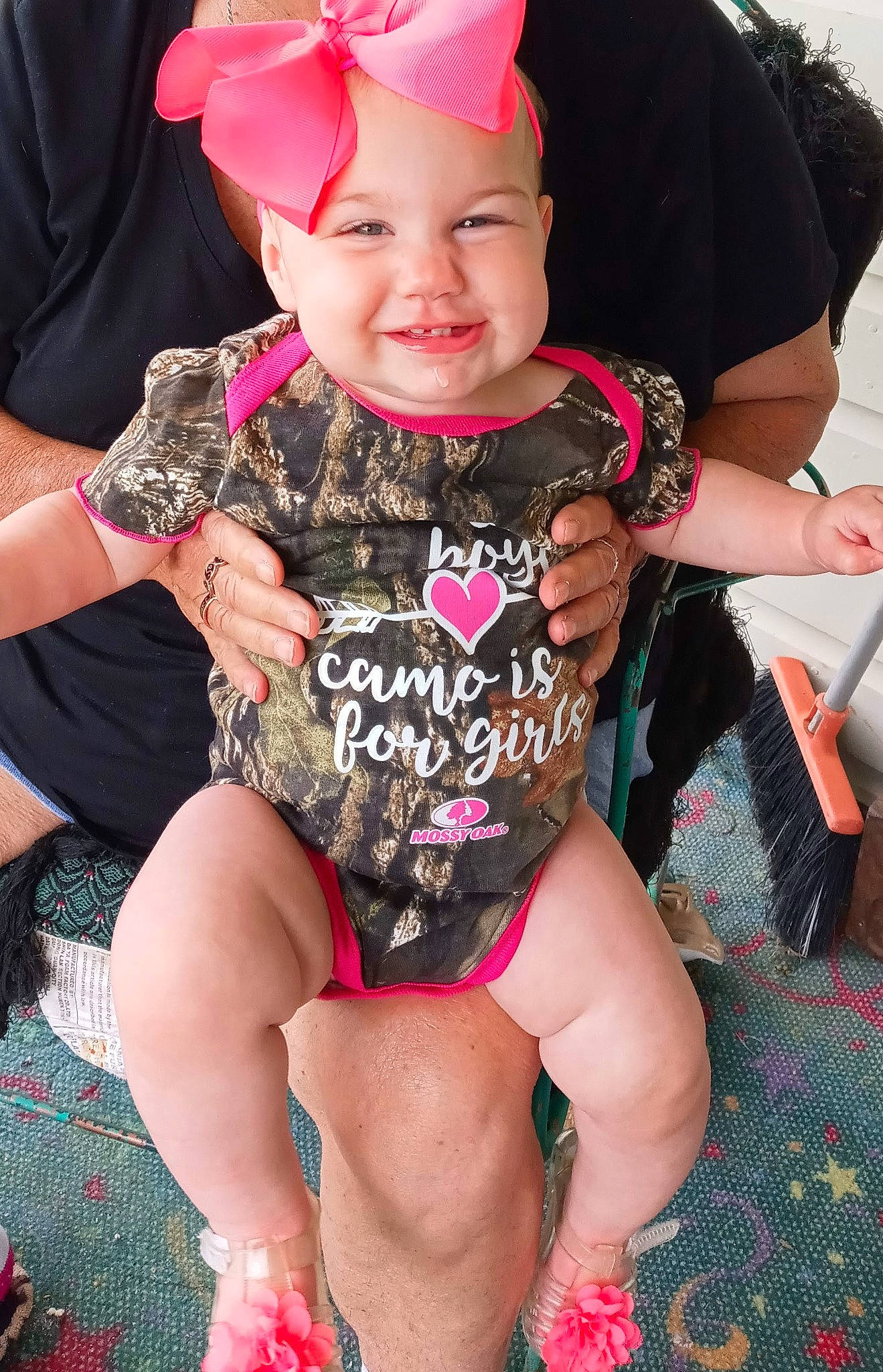 Emerson is registered to the contest to win money with this photo: baby, baby_toddler_clothing, cap, child, event, fashion, fun, happy, headwear, human_leg, joy, magenta, pattern, people, person, pink, purple, red, skin, sleeve