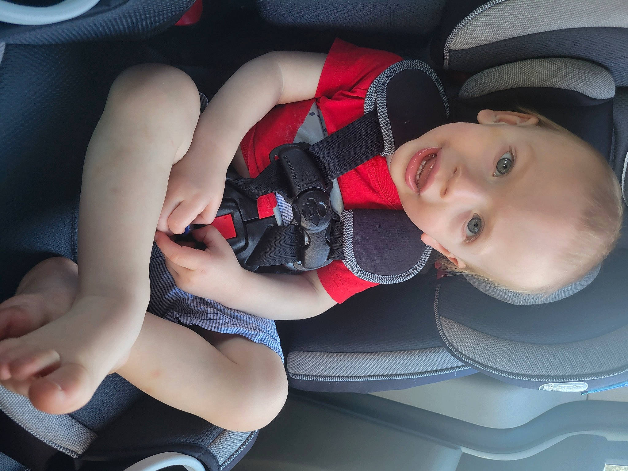 Isaiah joined the competition — help win amazing prizes! auto_part, automotive_design, automotive_wheel_system, baby, baby_carriage, baby_toddler_clothing, car_seat, child, comfort, electric_blue, finger, hat, human_leg, knee, lap, leg, mouth, person, smile, thigh