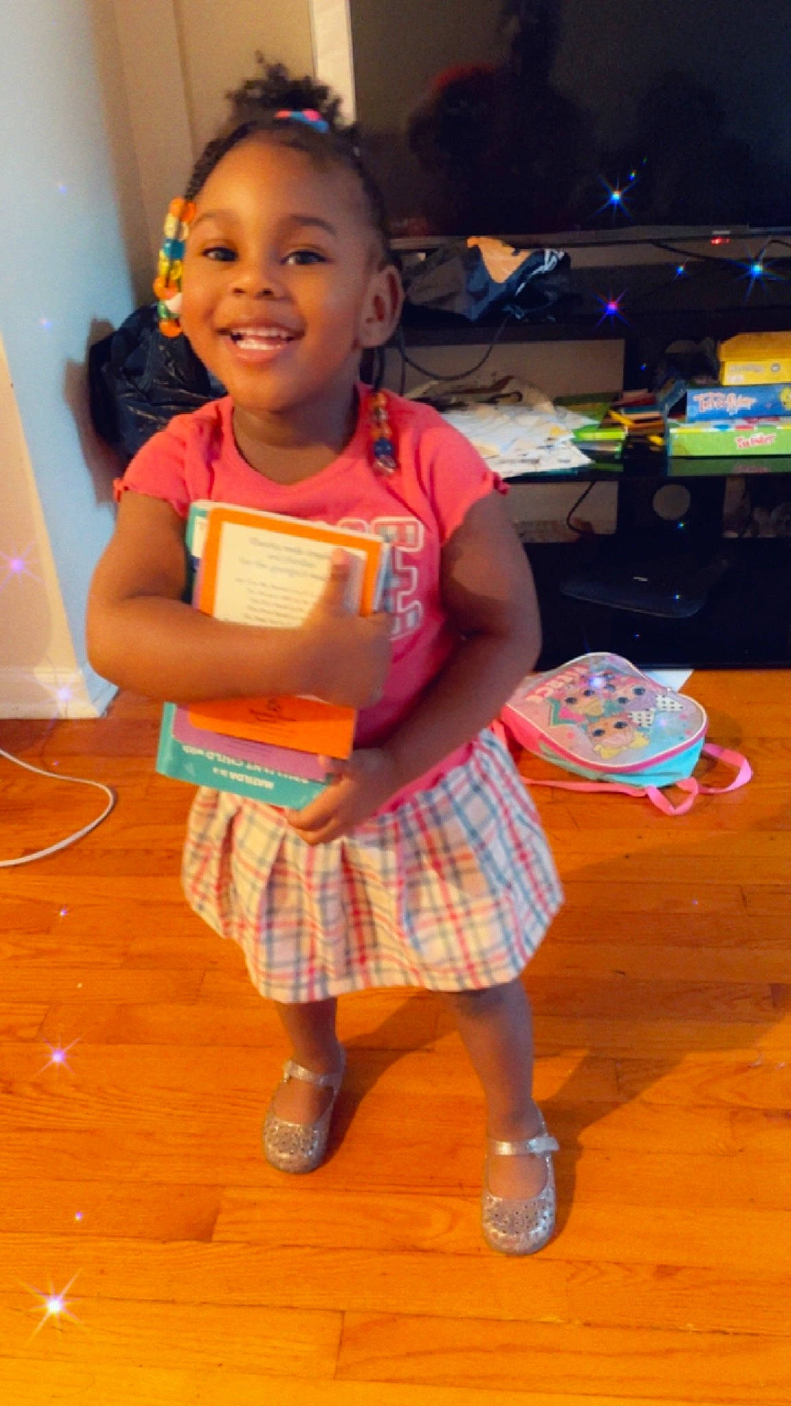 Gizelle joined the competition — help win amazing prizes! baby_toddler_clothing, child, event, flooring, fun, happy, hardwood, human_leg, joy, pattern, person, plaid, play, room, sitting, skin, smile, sock, t_shirt, tartan