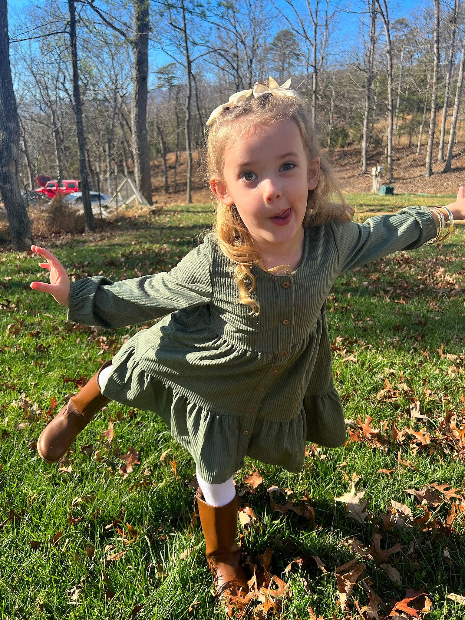 Macy joined the competition — help win amazing prizes! blond, gesture, grass, grass_family, grassland, happy, lawn, leaf, meadow, people_in_nature, person, plant, sky, sleeve, smile, soil, spring, terrestrial_plant, thumb, toddler