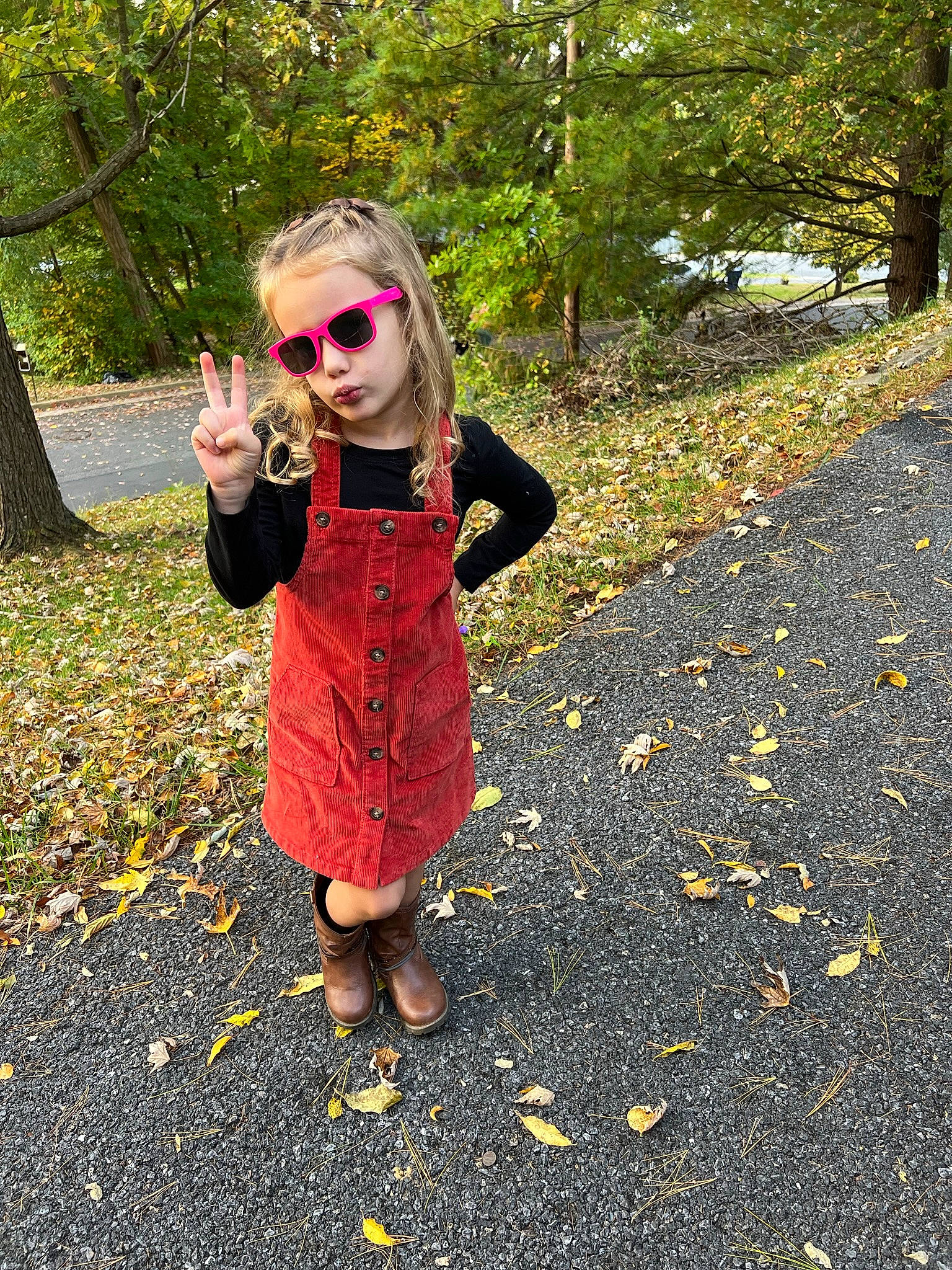Macy is registered to the contest to win money with this photo: asphalt, baby_toddler_clothing, child, deciduous, eyewear, goggles, grass, landscape, leaf, pattern, people_in_nature, person, plant, recreation, road_surface, sidewalk, sleeve, sunglasses, tints_and_shades, toddler