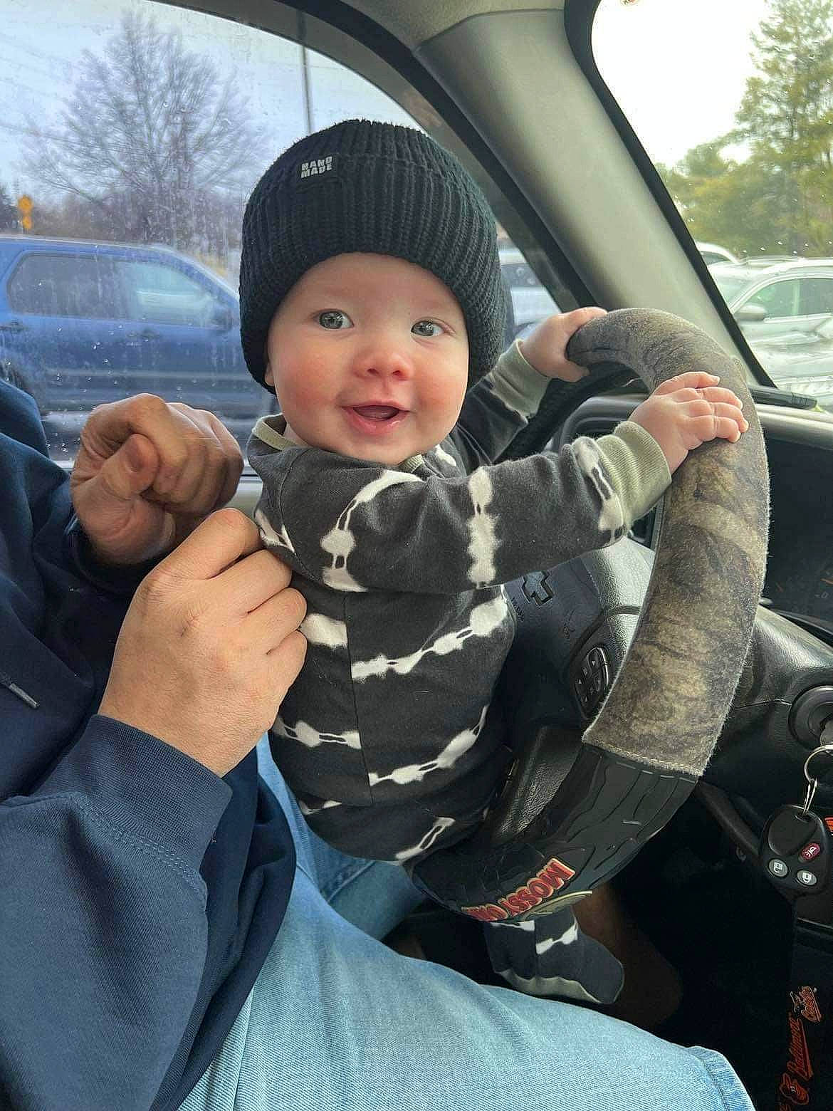 Carson joined the competition — help win amazing prizes! automotive_design, automotive_exterior, automotive_mirror, car, car_seat, car_seat_cover, cool, finger, gesture, head_restraint, headwear, mode_of_transport, motor_vehicle, person, sky, smile, steering_wheel, toddler, tree, vehicle