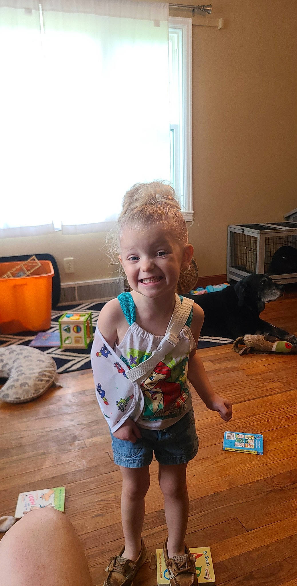 Amari joined the competition — help win amazing prizes! baby, baby_toddler_clothing, barefoot, cabinetry, child, floor, flooring, foot, fun, happy, hardwood, joy, laminate_flooring, living_room, person, sitting, smile, t_shirt, toddler, window