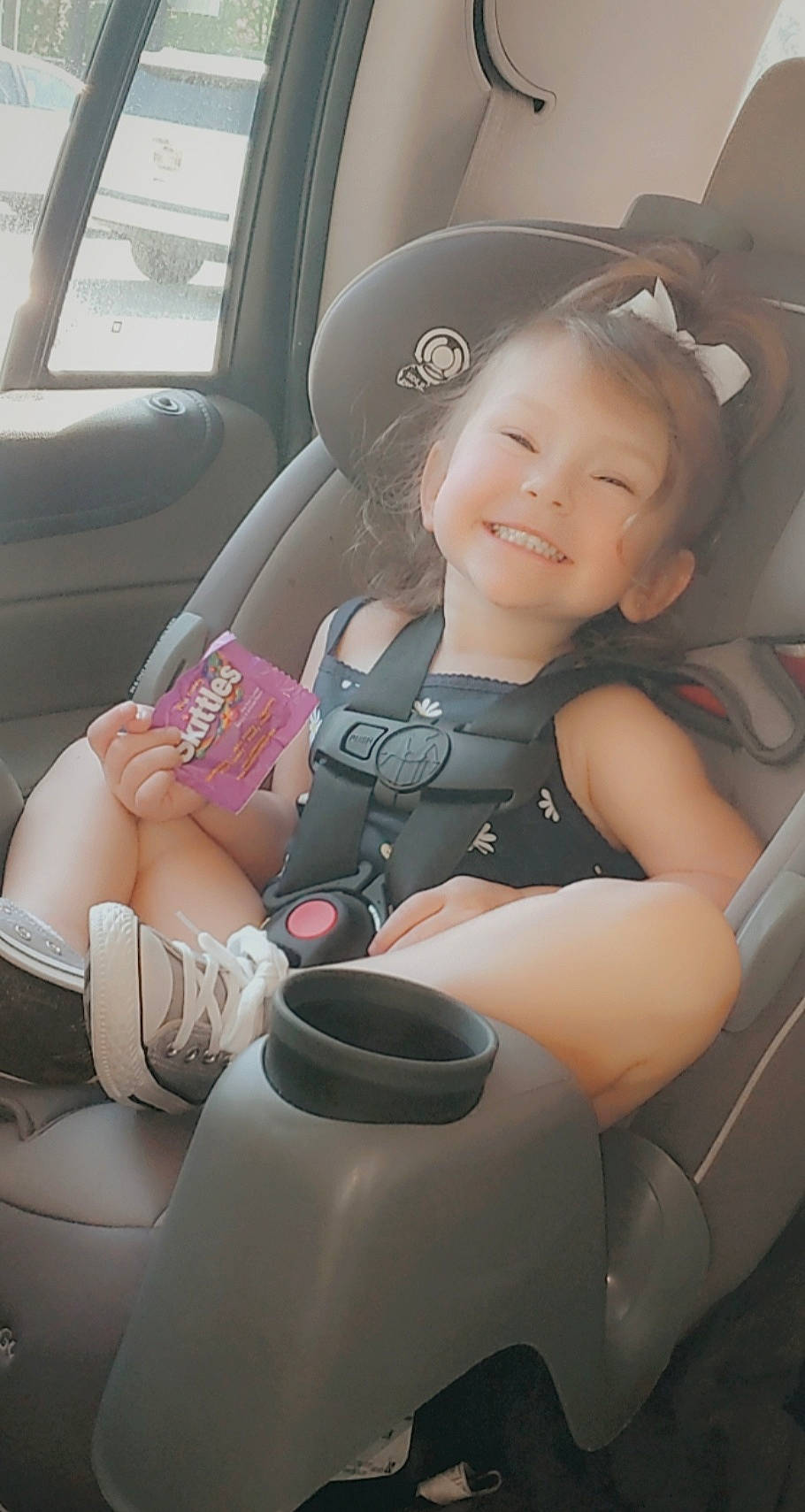 Anna Grace is registered to the contest to win money with this photo: arm, automotive_design, automotive_exterior, car, car_seat, car_seat_cover, comfort, finger, hand, head_restraint, human_body, joy, leg, motor_vehicle, person, seat_belt, skin, smile, steering_part, steering_wheel