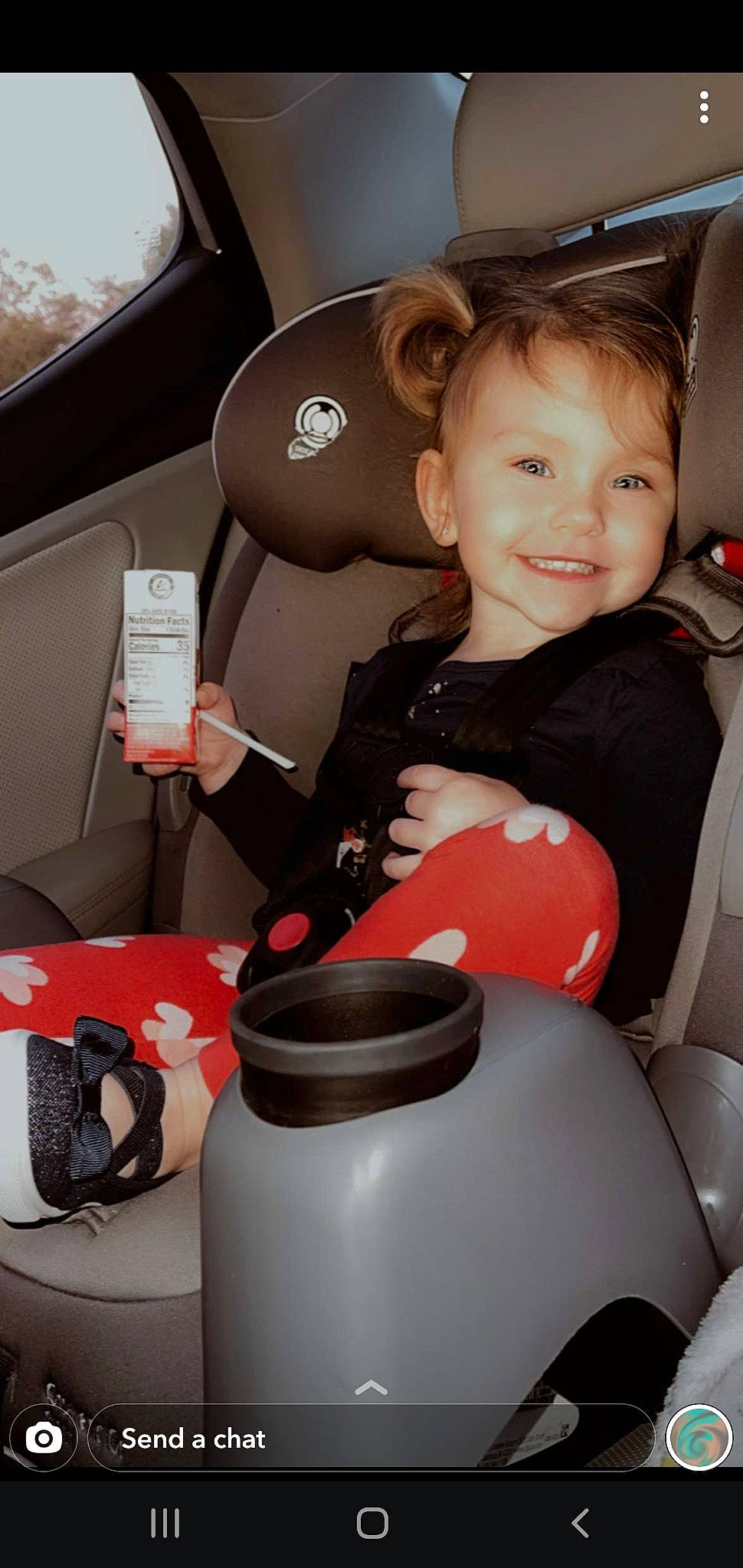 Anna Grace is registered to the contest to win money with this photo: auto_part, automotive_design, baby, baby_products, car_seat, car_seat_cover, comfort, family_car, fun, head_restraint, human_leg, joy, luxury_vehicle, motor_vehicle, person, smile, steering_part, steering_wheel, thigh, toddler