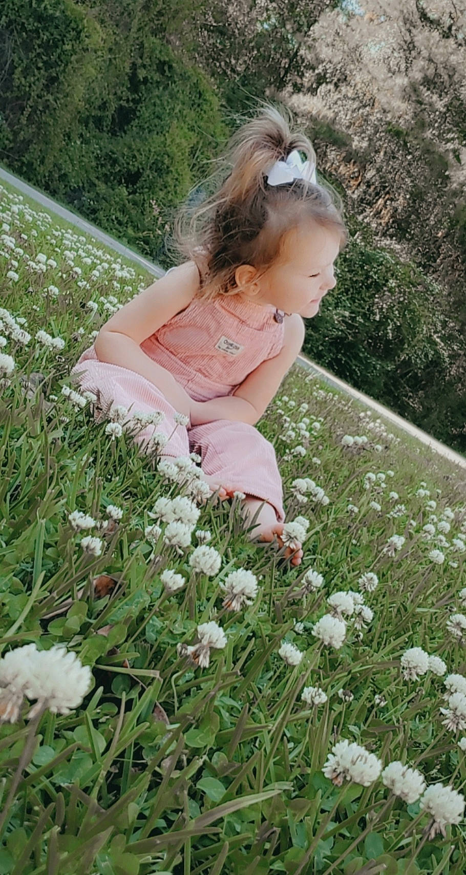 Anna Grace is registered to the contest to win money with this photo: baby, baby_toddler_clothing, botany, dress, eye, flower, flowering_plant, grass, grass_family, grassland, groundcover, happy, lawn, leaf, meadow, people_in_nature, person, petal, plant, sunglasses